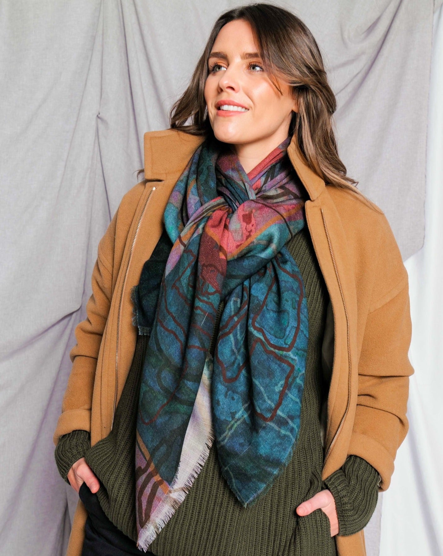deep blue green scarf styled with winter coat